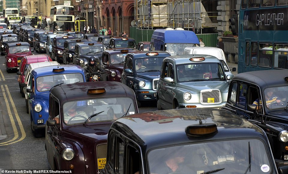 48331037-10034233-Taxi_drivers_also_joined_in_the_protest_They_are_seen_above_hold-a-80_163276899029