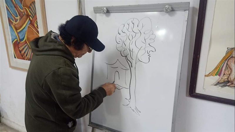 جانب من ورش فن الكاريكاتير